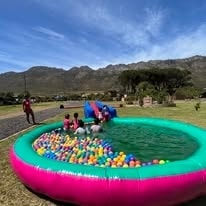 Inflatable ball pool with Hottentots Holland mountains in the background at WildWind