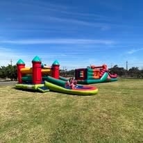 Large inflatable obstacle course on the WildWind resort lawn