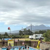WildWind pool area with caravan and Hottentots Holland mountains in the background