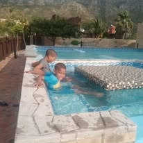 Children playing in the WildWind pool on a sunny day