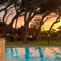 WildWind pool at sunset with warm golden light reflecting on the water