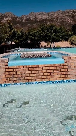 Close-up of the WildWind pool waterfall feature with clear cascading water